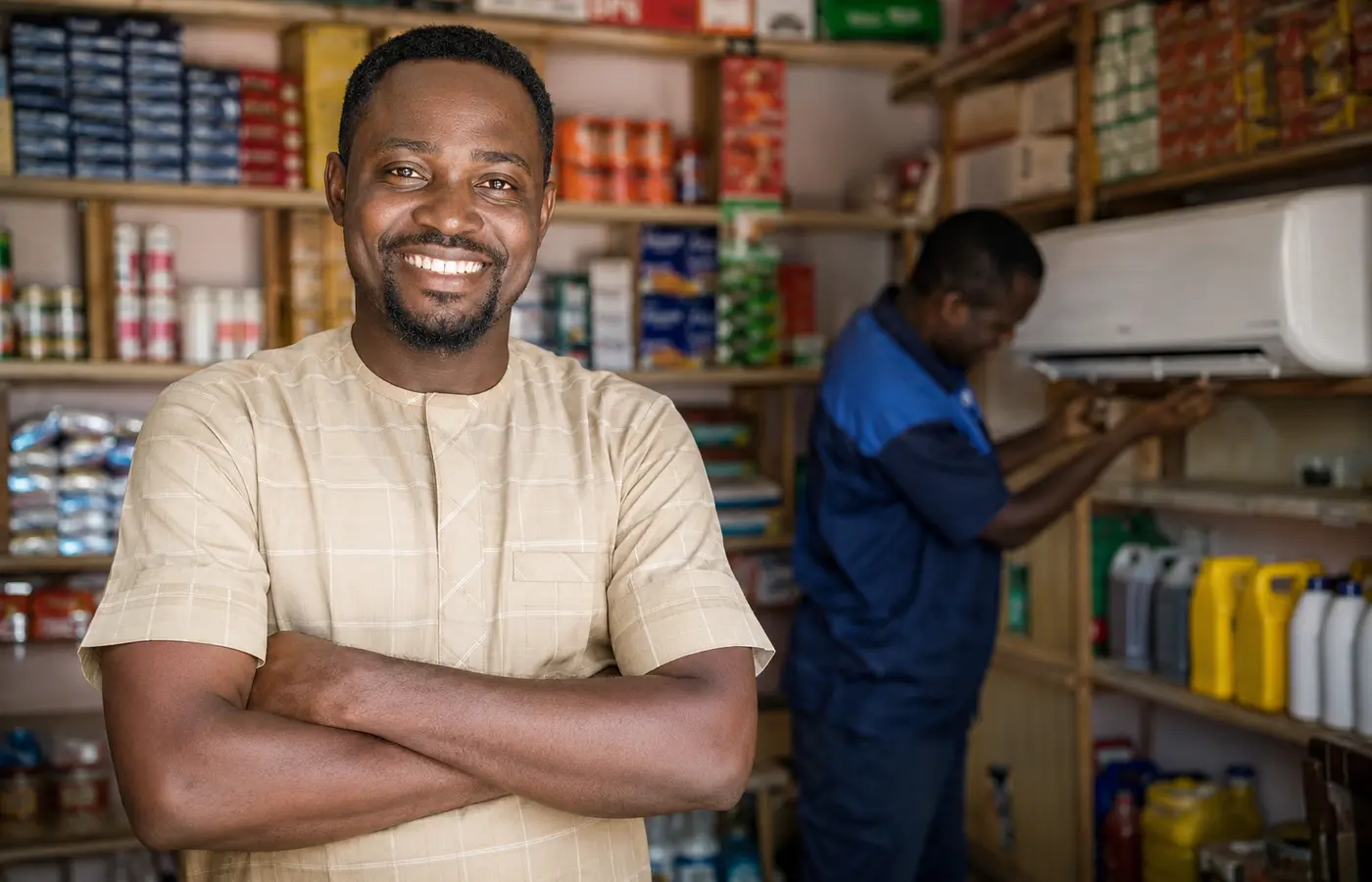 Smiling Nigerian business owner after equipment service